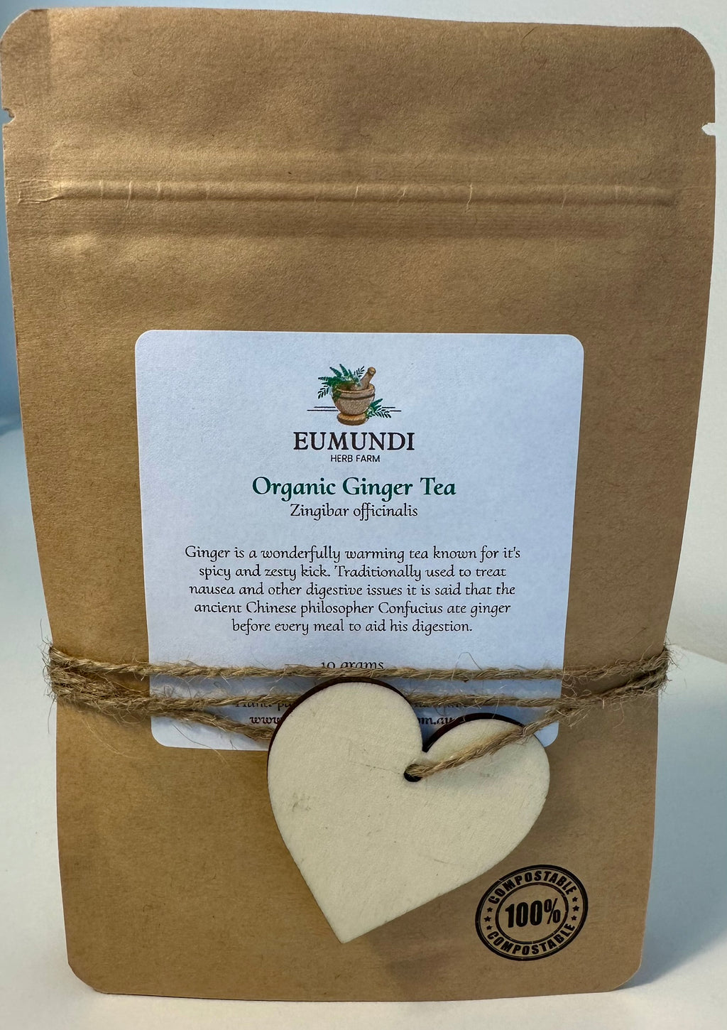 Eumundi Organic Ginger Tea package with a heart-shaped tag on a white background