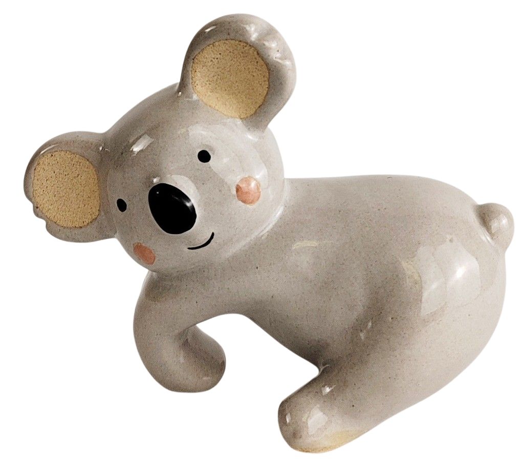 Ceramic koala figurine on a white background