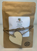 Eumundi Tulsi Tea package with a heart-shaped tag on a white background
